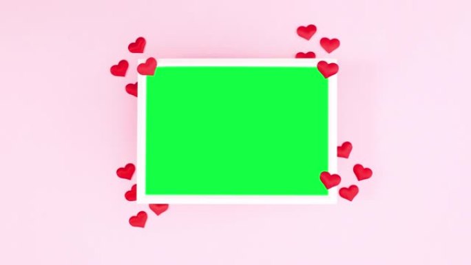 浪漫的爱情框架，绿色屏幕和粉红色主题的红心。停止运动