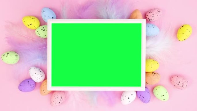 复活节快乐停止运动，带彩色鸡蛋、羽毛和绿色屏幕框架