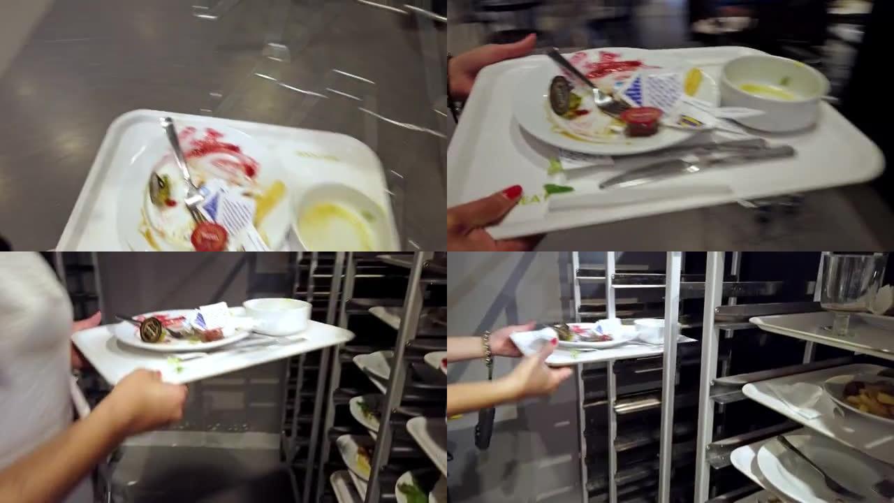 女顾客在宜家餐厅使用自助服务区，扔垃圾