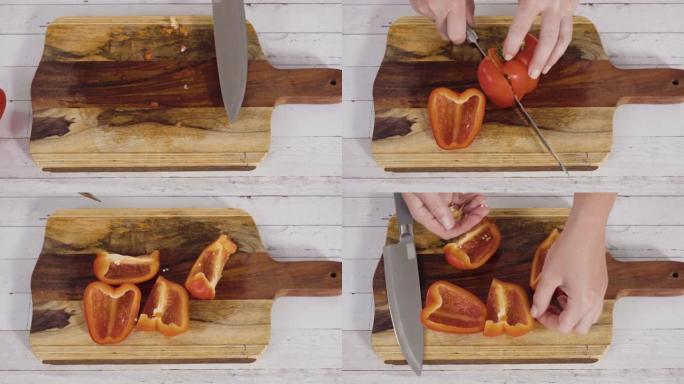 在木板上切碎有机红甜椒。