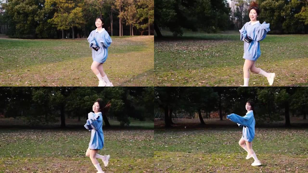 阳光明媚的日子，快乐的女孩在森林公园跑步，美丽的中国年轻女子的肖像在户外玩耍，4k慢动作镜头。