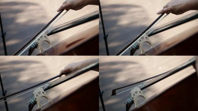 一个女人用低音提琴演奏的特写镜头。