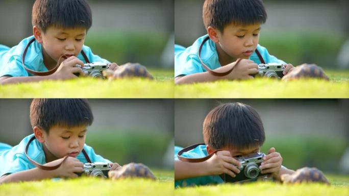 亚洲孩子和他的宠物乌龟一起玩。友谊的概念