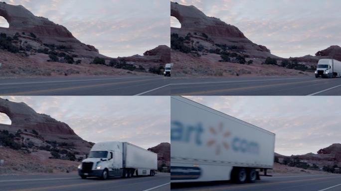 半卡车在犹他州西南部靠近摩押和威尔逊拱门的高速公路上行驶