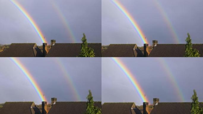 房子屋顶上美丽的双彩虹，阴天，放大