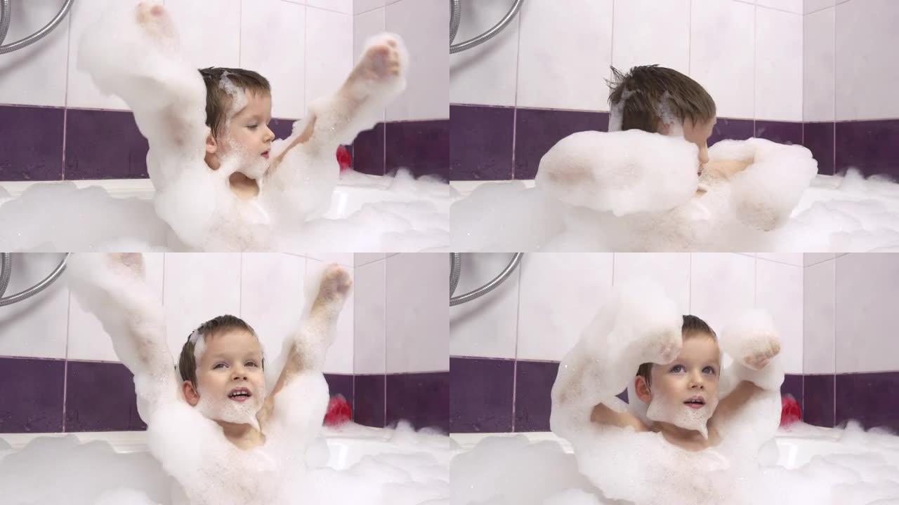 一个快乐微笑的小男孩的特写镜头，浴缸里有很多泡沫。他拍手foam.4 k