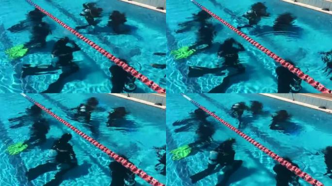 潜水员在游泳池中进行水下水肺潜水。