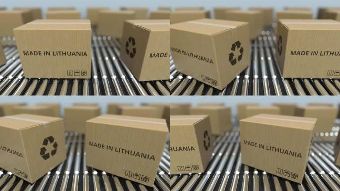 滚筒输送机上带有立陶宛制造文本的盒子