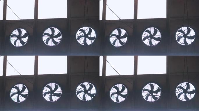 工业通风机。工厂空气循环系统。在工厂旋转大型风扇