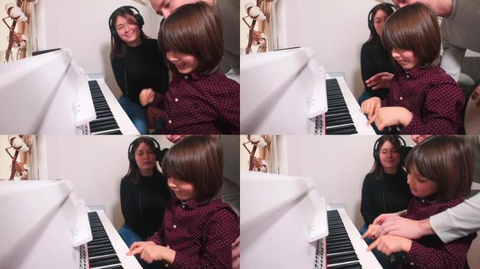 青少年拒绝向老师学习音乐。用手关闭钢琴键。