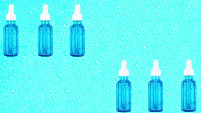 玻璃瓶中的精华保湿精华液在水滴的蓝色背景上移动。用于水合的透明质酸。潮流化妆品概念。化妆品和皮肤护理