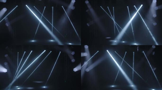 五颜六色的舞台灯。白色聚光灯和激光全息图会旋转，转动并发出明亮的光束。表演或迪斯科舞厅期间音乐厅和舞