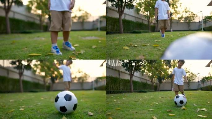 亚洲孩子在公园，房子的后院踢足球。度假和健康的概念