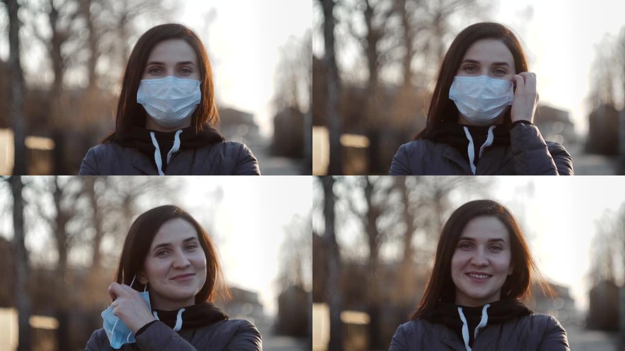 病毒口罩西班牙女子在街头戴口罩摘下口罩结束冠状病毒19的隔离。大流行疫情结束