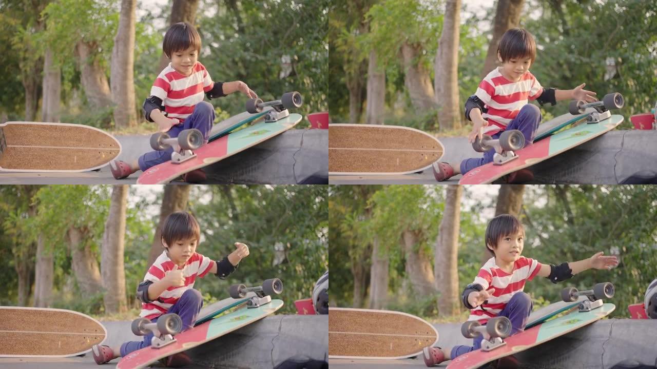 亚洲男孩快乐地玩滑板轮。
