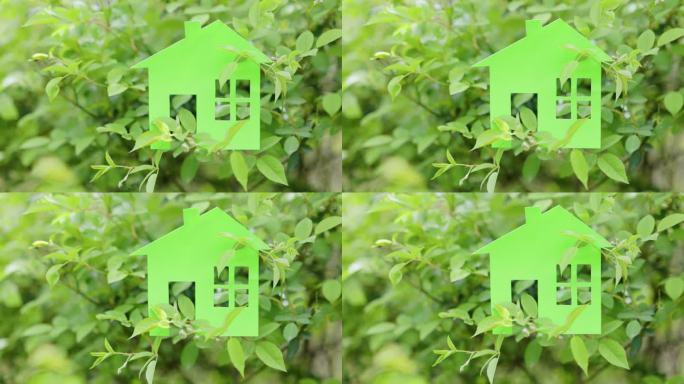 4K春天绿色树叶上的纸房子模型