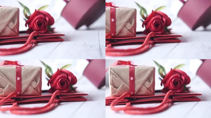 桌子上玫瑰花和礼品盒的特写