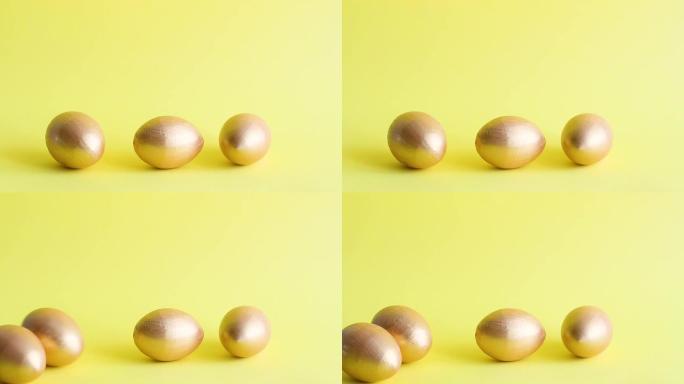 黄色背景上的复活节金色装饰蛋