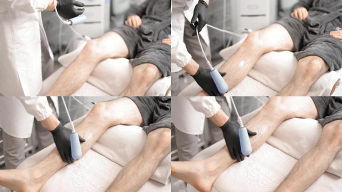 医生对男性腿部进行磁疗