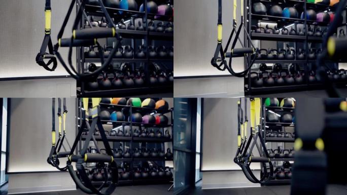 现代健身房的球、壶铃和trx系统。