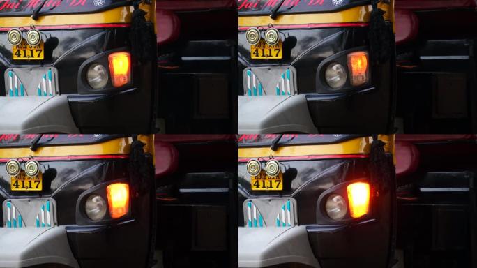 匿名三轮车自动人力车停在路边的前灯指示器的详细信息。
