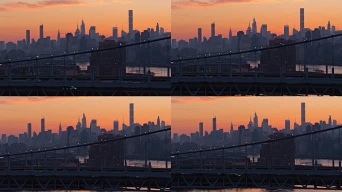 日落时分，在RFK大桥和阿斯托里亚的经济适用房项目上，曼哈顿天际线轮廓的远处景色。具有复杂后摇相机运