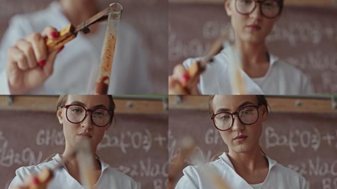 戴着眼镜的年轻女科学家在本生灯的明火上加热试管中的化学物质-特写