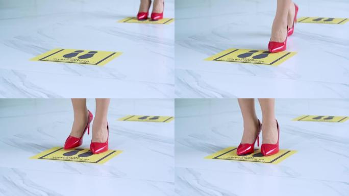 穿着红色鞋子的女性与他人保持距离1米保持距离，防止新型冠状病毒肺炎病毒，社交距离概念。