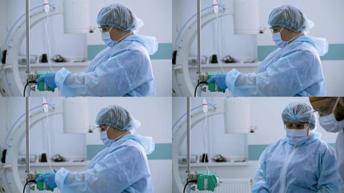 穿着防护服和口罩的护士的侧视图。医疗助理在现代手术室手术前准备设备。