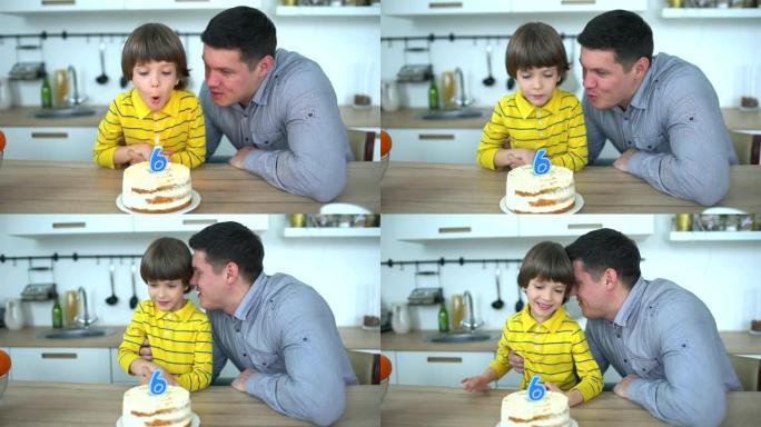非常可爱的男孩用蛋糕和快乐的父亲庆祝他的生日。6年生日快乐。小男孩在家吹灭生日蛋糕上的蜡烛