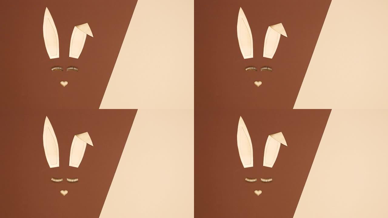 创意金色复活节兔子在裸色棕色背景上闪烁睫毛。停止运动