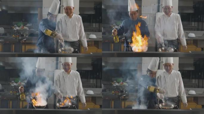 两名厨师在厨房用燃烧的火烹饪食物