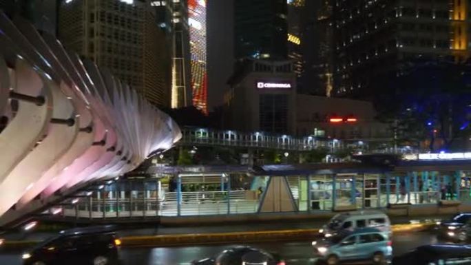 夜景照明雅加达市市中心著名现代人行天桥交通街顶部全景4k印度尼西亚