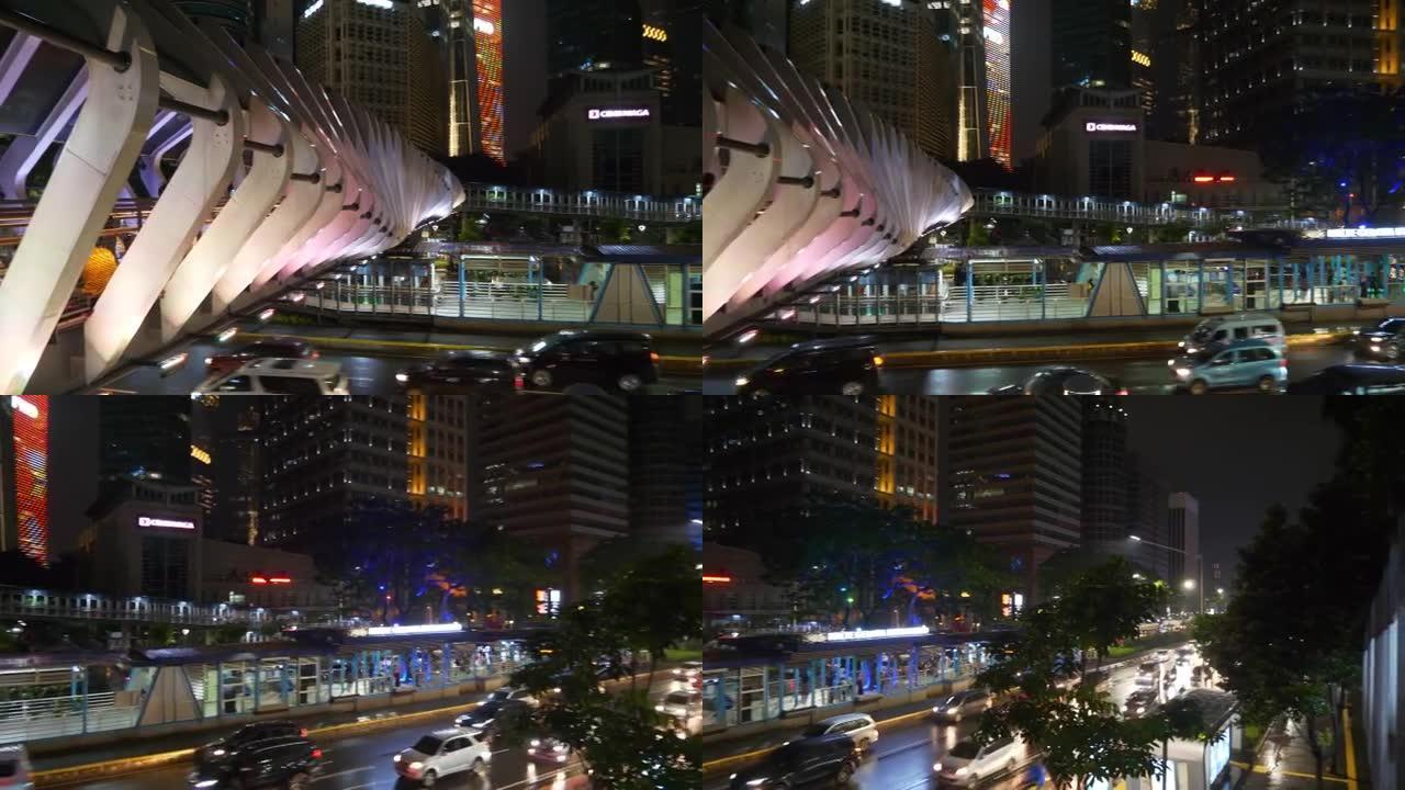 夜景照明雅加达市市中心著名现代人行天桥交通街顶部全景4k印度尼西亚