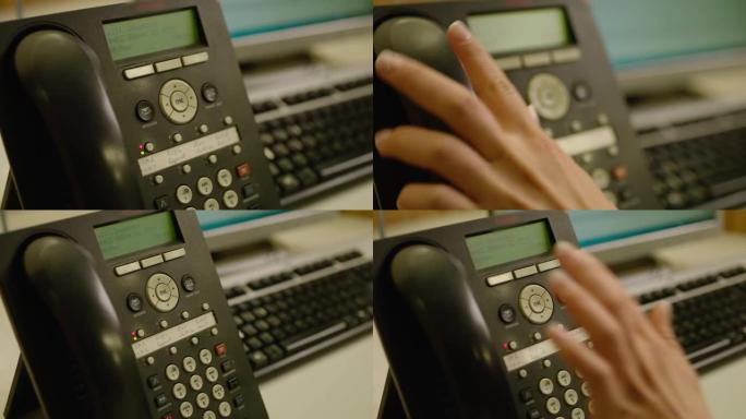 女人的特写手按下黑色座机电话的按钮并回答。呼叫中心。接线员拿起电话回答问题。办公室。客户支持中心。