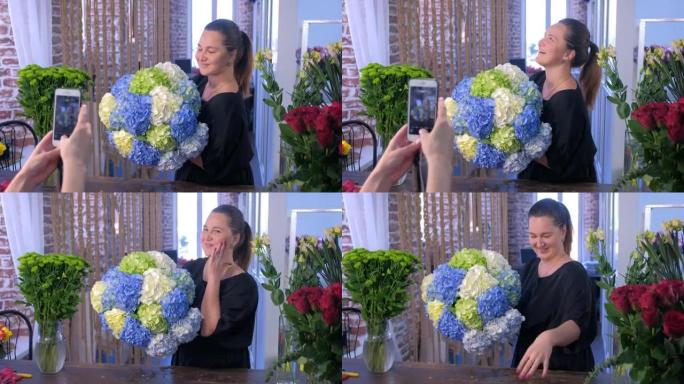 女花店摆着巨大的绣球花在电话上拍照。