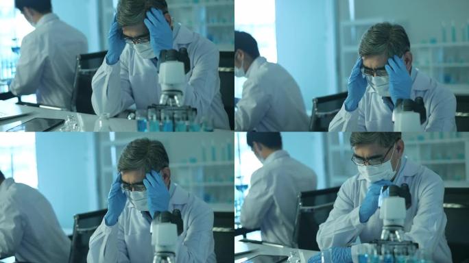 实验室，科技医疗保健概念中的沮丧和压力大的科学家