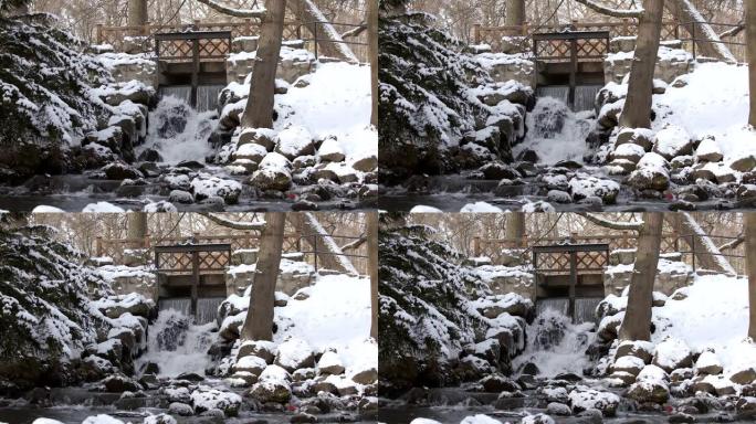 斯洛莫美丽的瀑布冬天冰冷，小桥下有石头