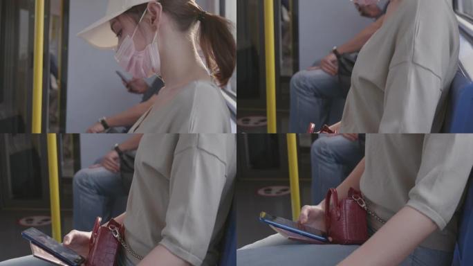 戴着冠状病毒面具的女旅行者在去机场的路上坐在火车上睡着了。