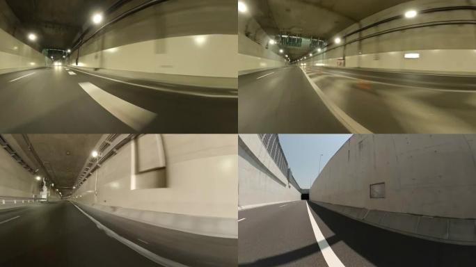 在公路隧道上行驶/从汽车拍摄的后方和侧视图。