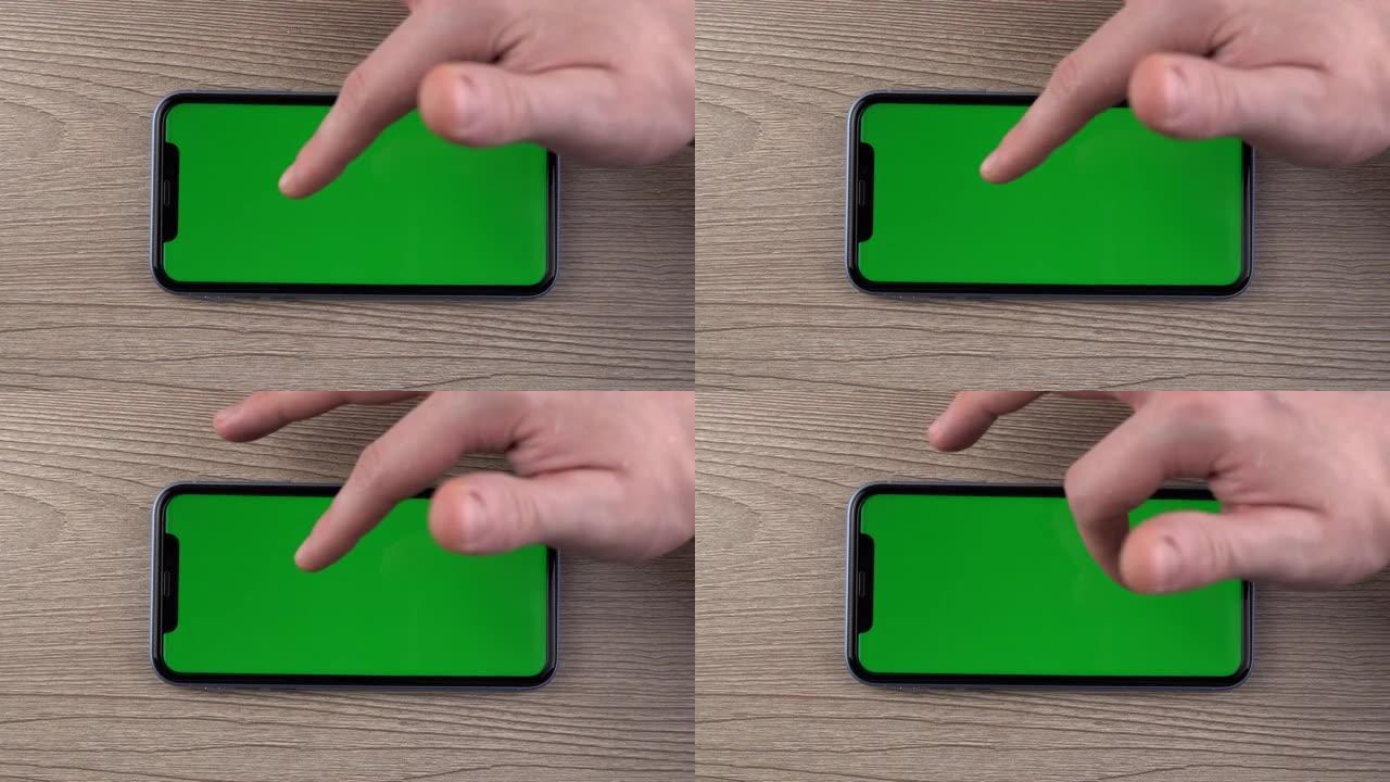 带有绿屏模型的智能手机滑动滚动手势手关闭手机