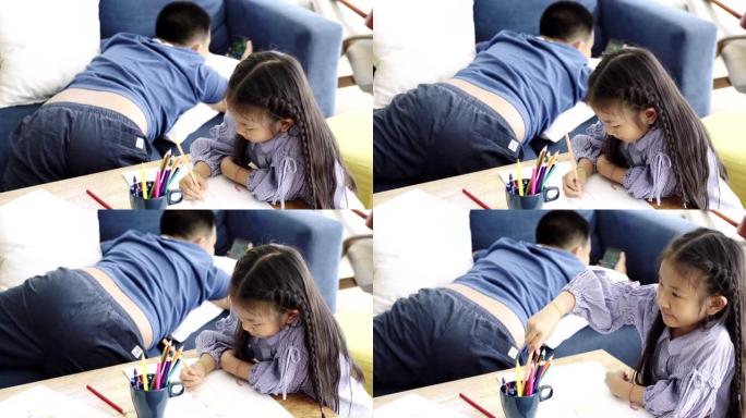 亚洲儿童在家画画水杯抱枕长发