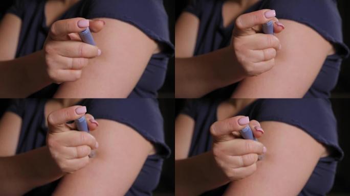 一名年轻女子用胰岛素笔向手臂注射胰岛素的特写镜头。
