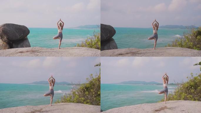 瑜伽姿势的女人海平面海景唯美金鸡独立