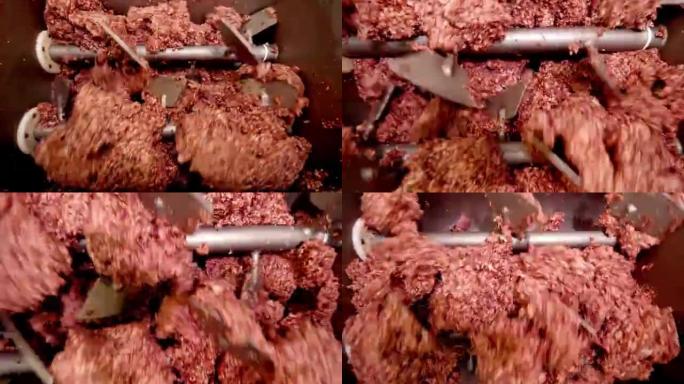 在肉厂特写镜头的巨大绞肉机上加工猪油或肉。