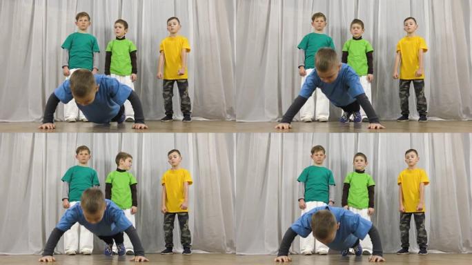 穿着蓝色t恤的运动员从地板上训练俯卧撑