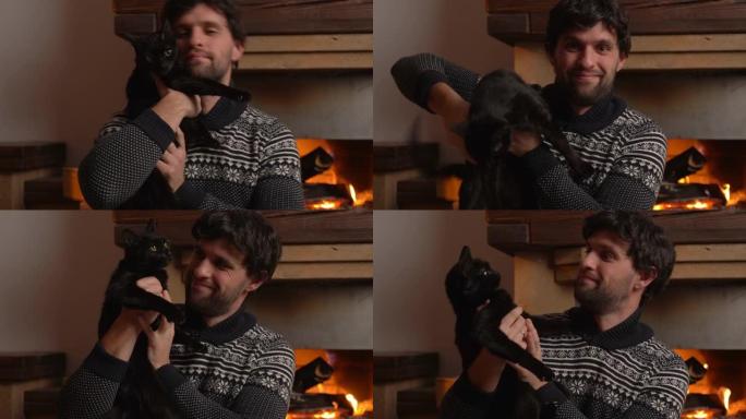 年轻人坐在壁炉旁时抱着一只猫