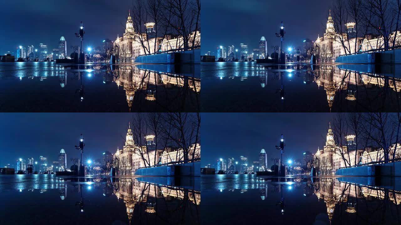 雨天上海外滩景观的4k延时镜头，夜间驾驶车灯完美反映历史建筑地标。