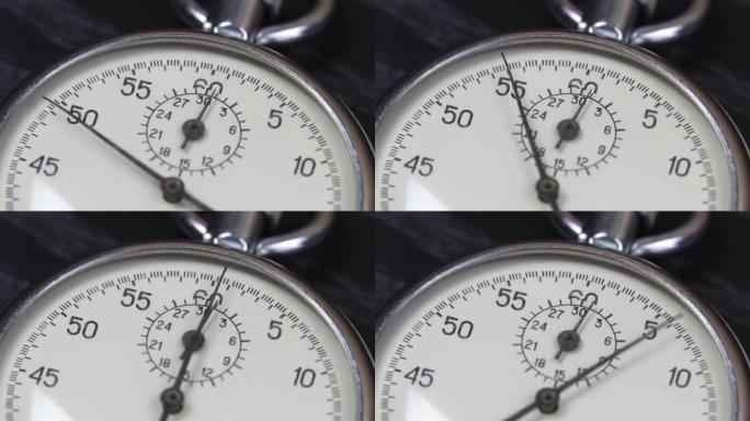 深色木桌上的秒表。时间测量工具