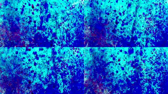 蓝色和红色的油漆滴入油中。4k镜头，微距拍摄，带有墨水和水的抽象背景。气泡漂浮在空间中，并慢慢落下。